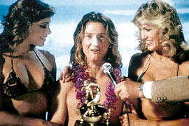 1979 Ford Bronco - Man accepts award with two women in bikinis.