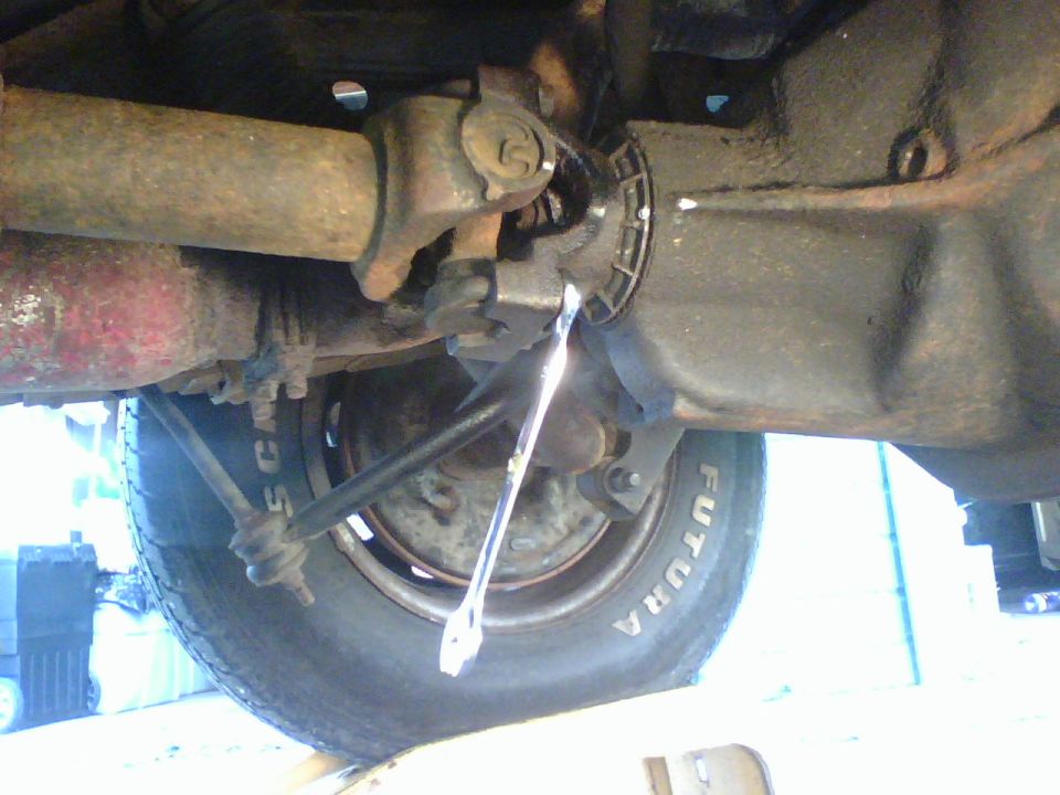 unfasten the ubolts and detach the driveshaft from the rear axel.