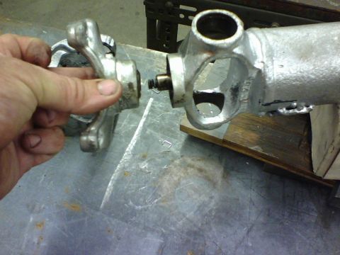 1989 Ford Bronco - The end mounting bracket has a swivel pressed into it and the hole in the swivel is where the spring on the right goes into. be careful dur…