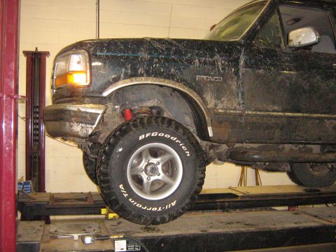 1995 Ford Bronco - This 1995 Ford Bronco is shown on a lift, likely for maintenance or repair.