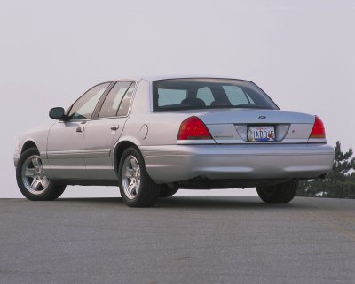 2002 Ford Crown Victoria - This 2002 Ford Crown Victoria is shown from the rear, with a clear view of its taillights and license plate.