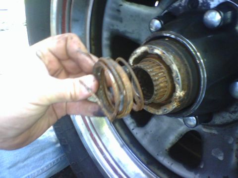 1989 Ford Bronco - Upon examination of the Auto hub I found that the spring was broken. I removed lockring to detach the spring assembly from the hub.