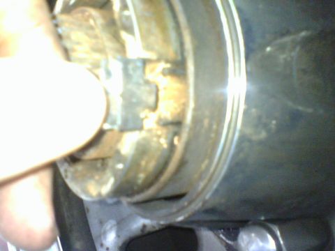 1989 Ford Bronco - I removed the safety clip from the wire hub retainer and used pair of needle nose pliers to bring the two ends of the wire together and out…