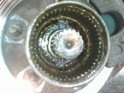1989 Ford Bronco - next I removed the bearing washer. the many holes in the washer are for the pin in the bearing adjusting nut. Upon removal of the bearing a…