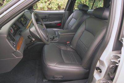 2002 Ford Crown Victoria - Interior view of a 2002 Ford Crown Victoria, highlighting the front seating area and dashboard.
