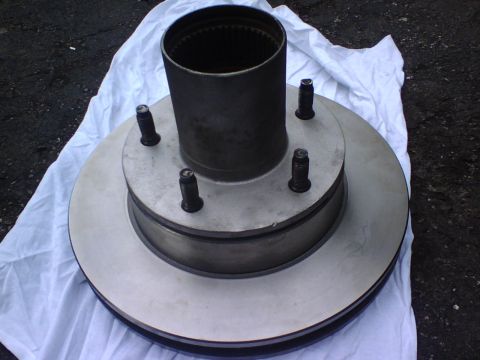 1989 Ford Bronco - here is the new brake rotor and the rehabed hub with bearings and grease inside.