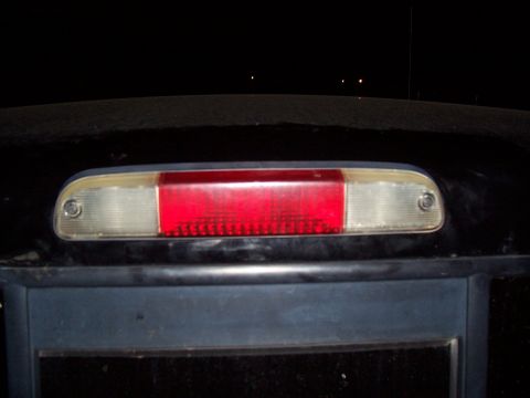 2003 Ford Ranger - The rear of a vehicle is shown at night, focusing on the third brake light assembly.