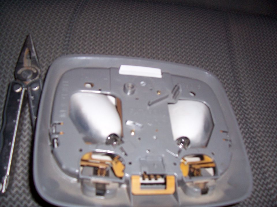 Interior light assembly with pliers nearby