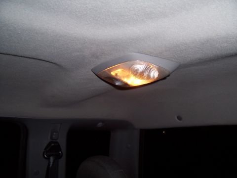 2003 Ford Ranger - The interior dome light assembly is visible against the gray headliner.