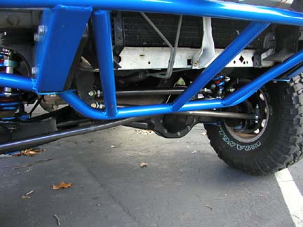 1984 Ford Bronco - Close-up view of a vehicle's suspension and roll cage, with a Supermotors.net watermark.
