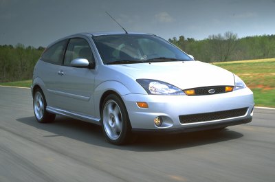 2002 Ford Focus - Silver 2002 Ford Focus SVT hatchback captured in a front 3/4 view while in motion on a paved road.