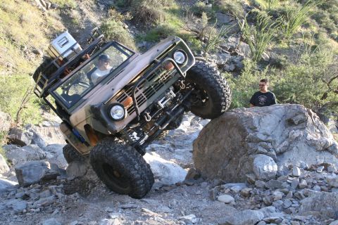 1966 Ford Bronco - This 1966 Ford Bronco navigates a challenging rocky terrain, demonstrating its off-road capabilities.