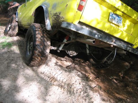 1997 Dodge 1500 - This 1997 Dodge 1500 is deep in the mud, with its rear axle and suspension clearly visible.