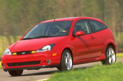 2002 Ford Focus - Red 2002 Ford Focus SVT hatchback seen from a 3/4 front angle on a road.