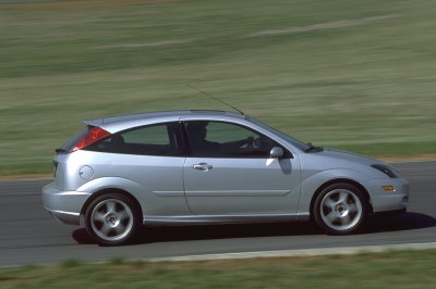 2002 Ford Focus - Silver 2002 Ford Focus SVT hatchback captured in motion on a paved road.