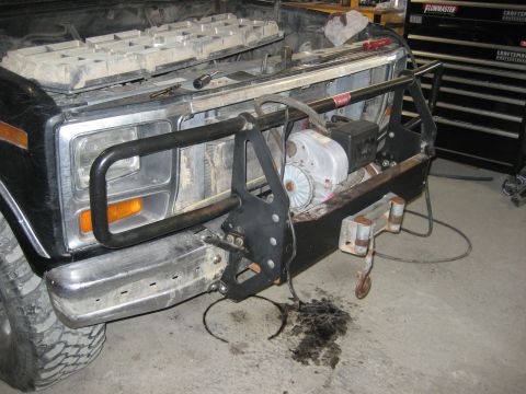 1986 Ford Bronco - Front view of a Ford Bronco, modified with a winch and brush guard.