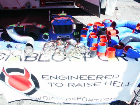 2001 Mercury Grand Marquis - Automotive parts and accessories are displayed on a table, including silicone hoses and metal clamps.