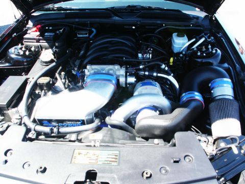 2001 Mercury Grand Marquis - Custom engine bay with a prominent supercharger and air intake system.