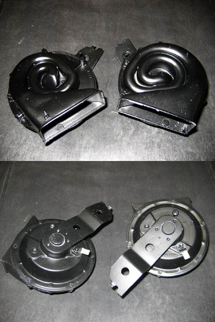 1971 Ford Ranchero - Pair of car horns displayed against a dark background. No year or make is visible.