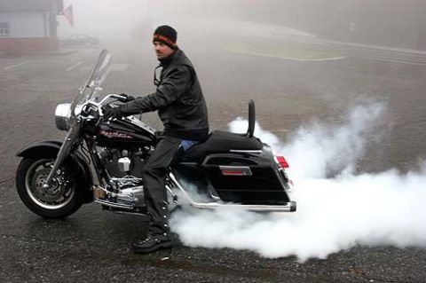 1992 Ford Mustang - Motorcycle burnout in a foggy parking lot.