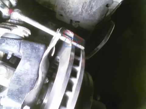 1989 Ford Bronco - Close-up of a vehicle's brake caliper and rotor assembly.