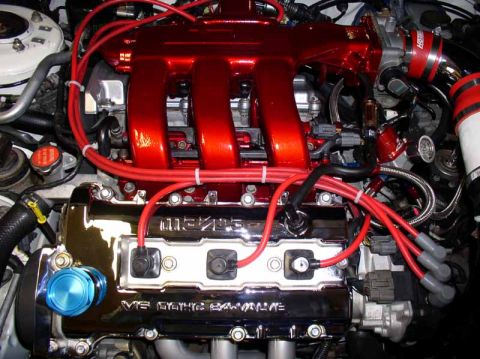 1996 Ford Probe - Customized engine bay a red intake manifold and a chrome V6 DOHC 24-VALVE engine cover.