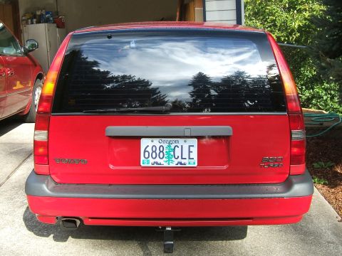 1987 Volkswagen Golf - Rear view of a red Volvo wagon, showing its license plate and model designation.