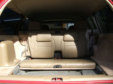 1987 Volkswagen Golf - Interior view of a vehicle's rear seating and cargo space with tan upholstery.