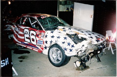 1995 Ford Mustang - This race car sustained significant damage to its front end and windshield.