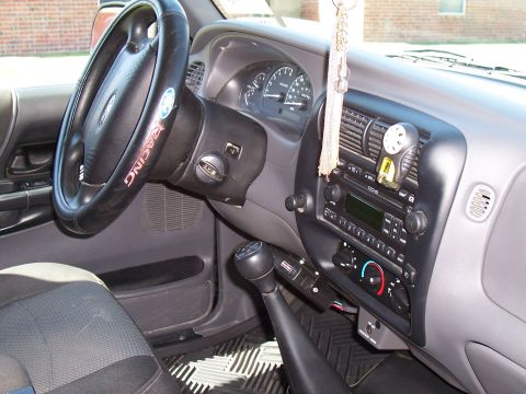 2003 Ford Ranger - The interior of a 2003 Ford Ranger shows the dashboard, steering wheel, and seats.