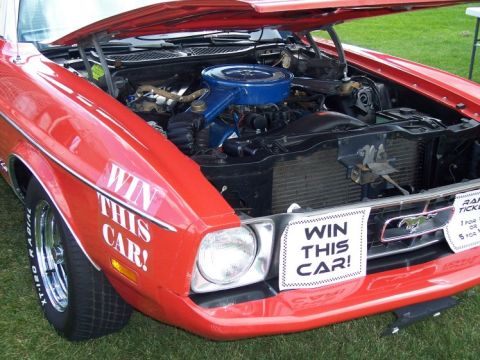 1972 Ford Ranchero - A red Ford Mustang is displayed with its hood open, "WIN THIS CAR!" signage.