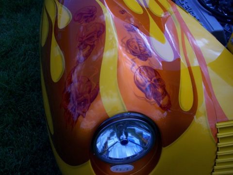 1972 Ford Ranchero - Custom airbrushed car hood displays flame graphics and skull imagery.