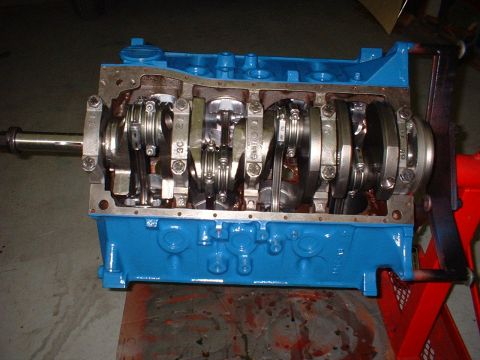 1969 Ford Mustang - This is a close-up view of an engine block assembly, showing the crankshaft and connecting rods.