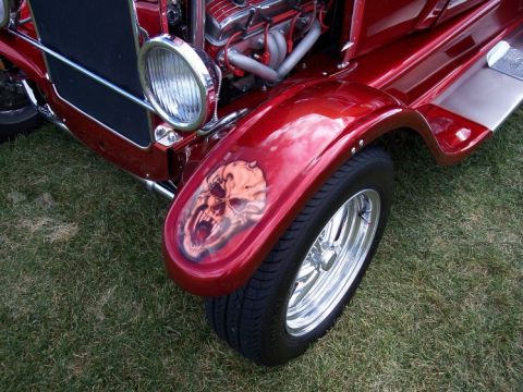1972 Ford Ranchero - A custom hot rod features a detailed airbrushed skull on its front fender.