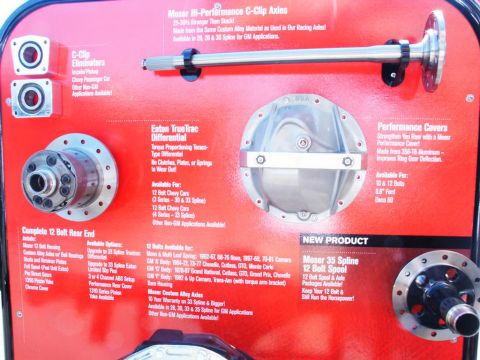 2001 Mercury Grand Marquis - Automotive parts display Moser C-Clip axles, an Eaton TrueTrac differential, and a Moser 35 spline spool, with product information and appl…