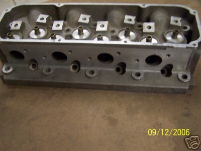 1972 Ford Ranchero - An aluminum engine cylinder head is shown, multiple ports and valve spring retainers.
