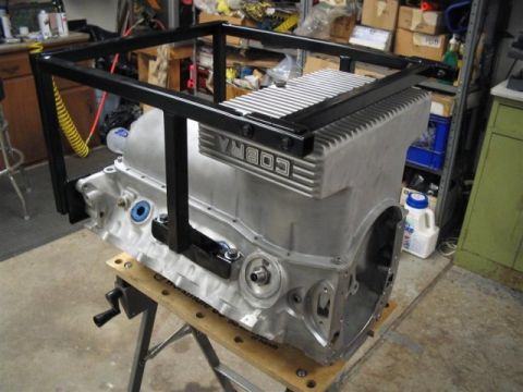 1972 Ford Ranchero - A Cobra engine block is mounted on a stand, ready for assembly or modification in a workshop setting.