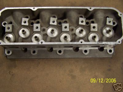 1972 Ford Ranchero - Close-up view of an engine cylinder head, showing internal components and bolt holes.