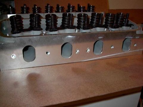 1972 Ford Ranchero - Close-up of an aluminum engine cylinder head, showing its internal components and ports.