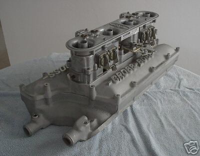 1972 Ford Ranchero - Aluminum dual carburetor intake manifold with "CROSS BOSS" cast into the side, resting on a blue towel.