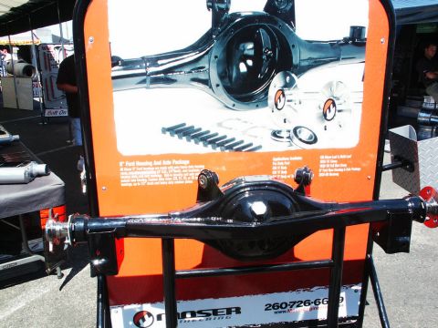 2001 Mercury Grand Marquis - A Moser Engineering rear axle assembly is displayed at a car show, with product information visible.