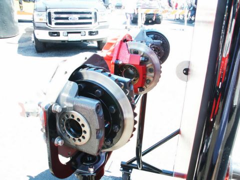 2001 Mercury Grand Marquis - Close-up of a differential assembly, with a Ford truck visible in the background.
