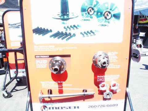 2001 Mercury Grand Marquis - Vendor display/literature board showing Moser Engineering axle, hub and C-clip eliminator products with descriptive text.