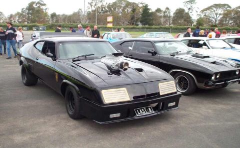 1972 Ford Ranchero - Modified black coupe with supercharger and custom plate 'LAST-8' parked outdoors.
