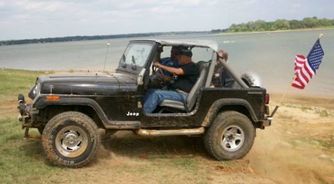 1993 Ford Bronco - Jeep with flag up and over berm