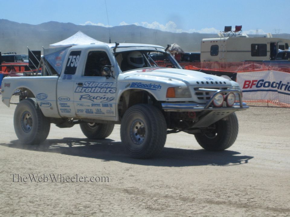 White number 758 Sierra Brothers Racing off-road truck on desert course