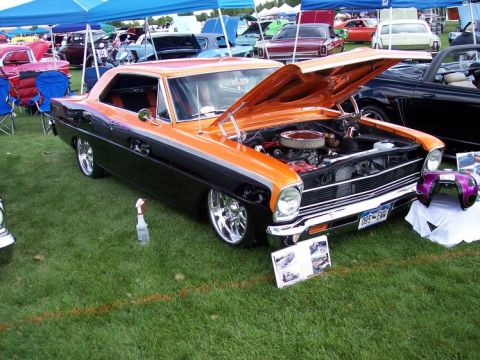 1972 Ford Ranchero - Custom 1966 Chevrolet Nova coupe on display at a car show.