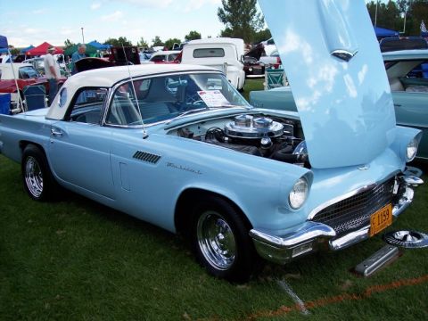 1972 Ford Ranchero - A classic 1957 Ford Thunderbird is displayed with its hood open at an outdoor event.
