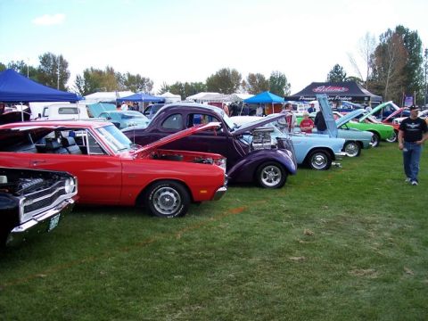 1972 Ford Ranchero - Multiple classic cars are displayed on a grassy field at an outdoor car show event.