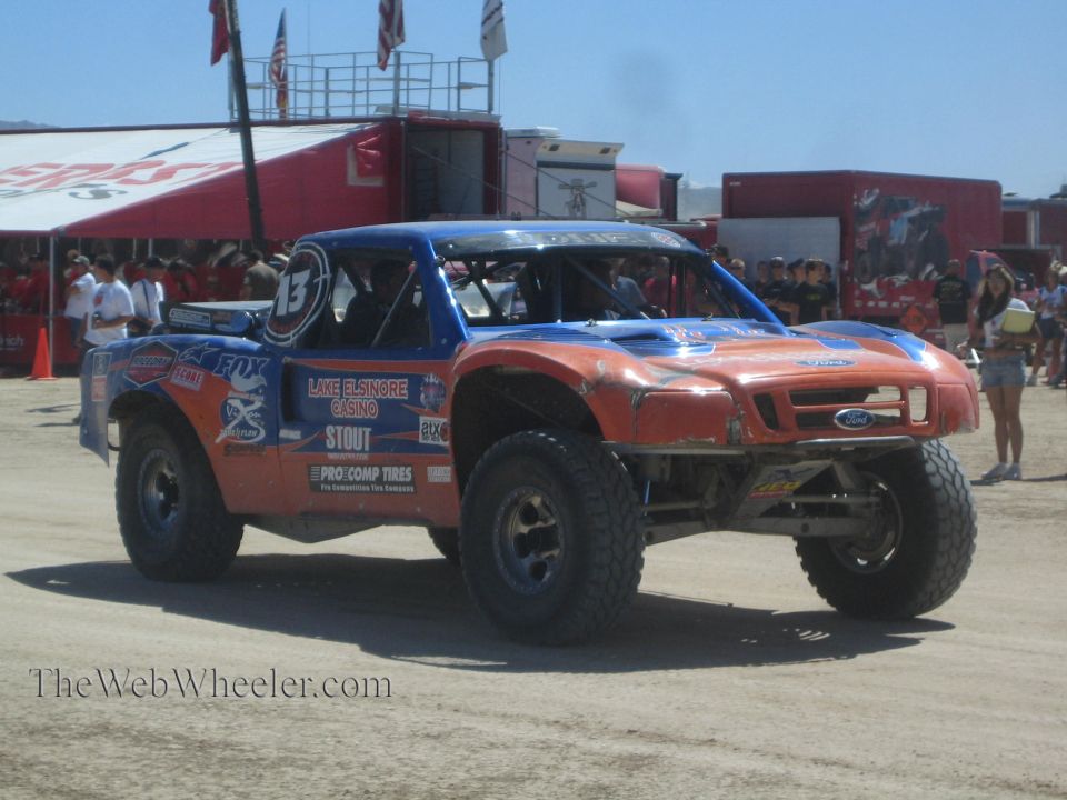 Blue and orange Lake Elsinore Casino Ford off-road race truck number 13